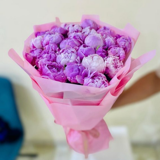 26 purple peonies